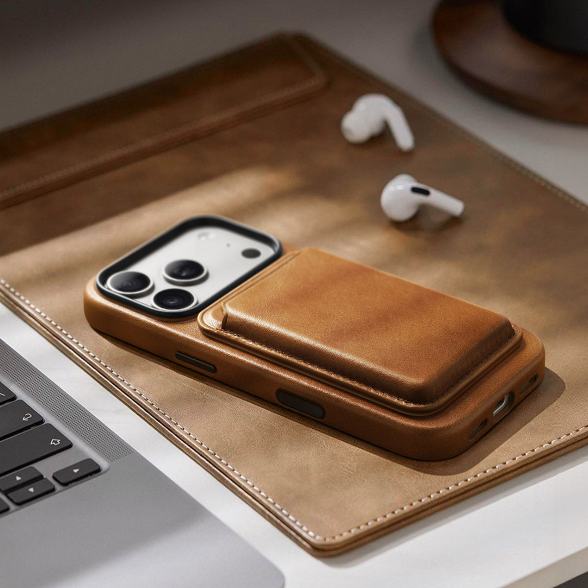 Brown leather phone case on a desk with a card wallet; wallet not included