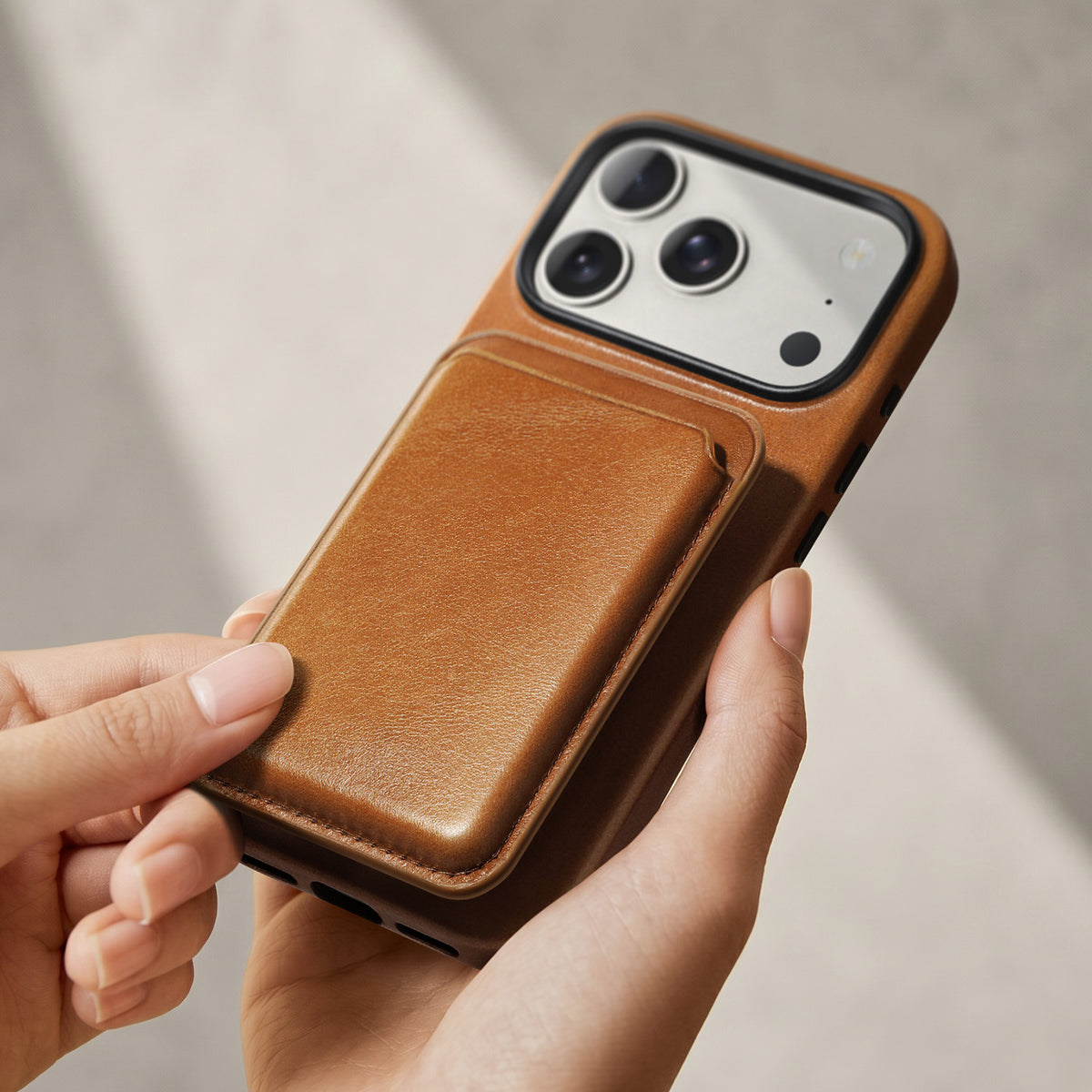 Brown leather phone case shown with a card wallet; wallet not included