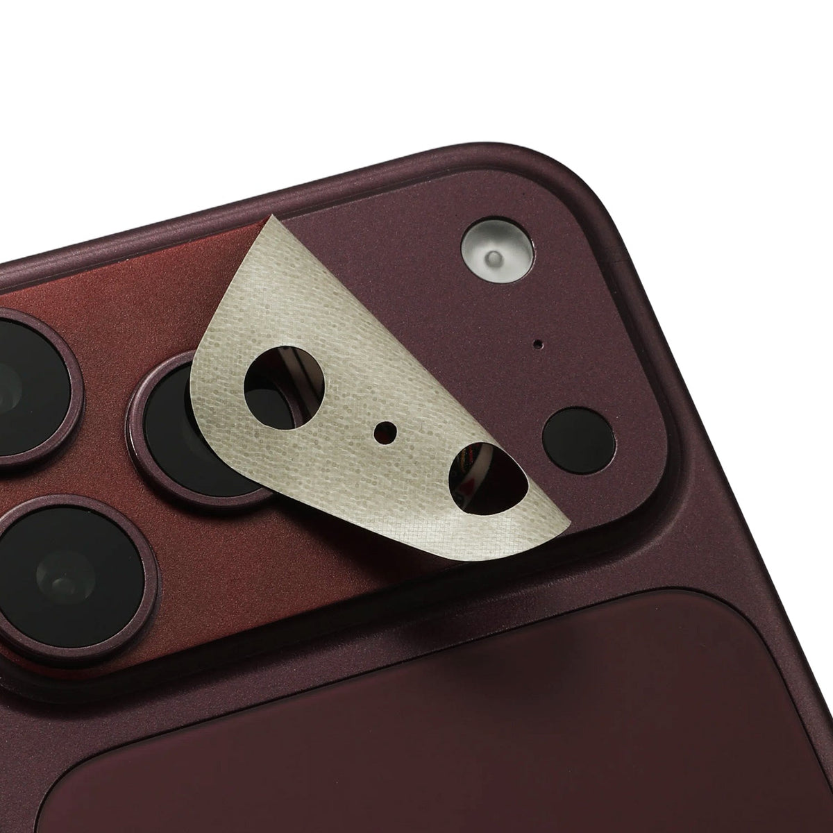 STICKSOO Camera Skin real photo on Burgundy iPhone 18 Pro Max, product detail view 4; alternate phone-colour reference photo