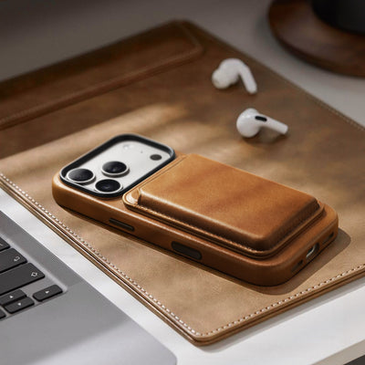 Brown leather phone case on a desk with a card wallet; wallet not included