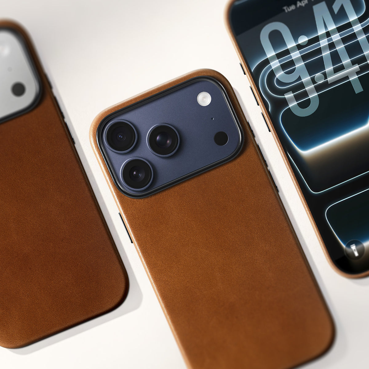 Brown leather phone case shown with three iPhone 17 Pro finishes