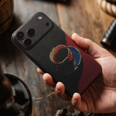 STICKSOO full-body Phone Skin, real photo on Burgundy iPhone 18 Pro Max, handheld lifestyle view; alternate-colour example for this product